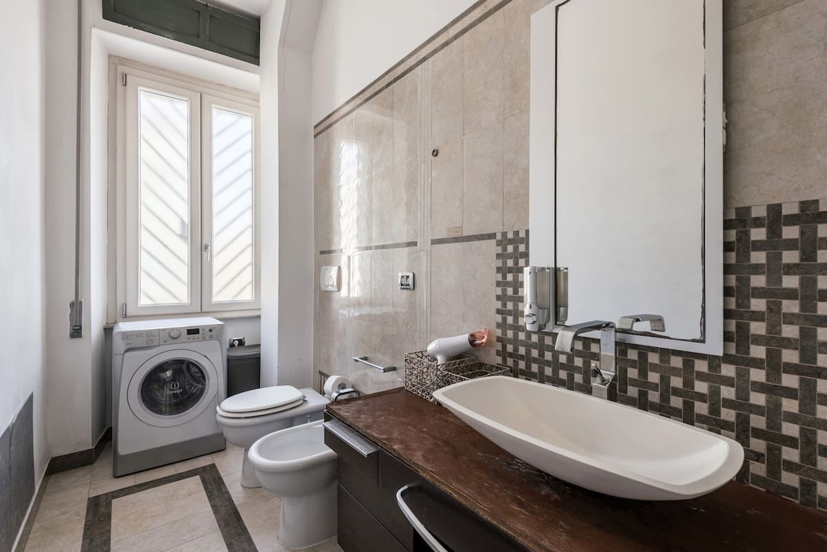 Versace marble bathroom with washer and dryer, Rome vacation rental