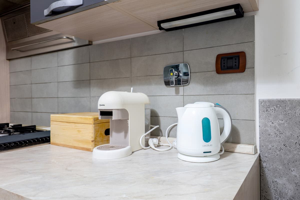 Coffee machine and kettle for an Italian espresso in the Rome apartment