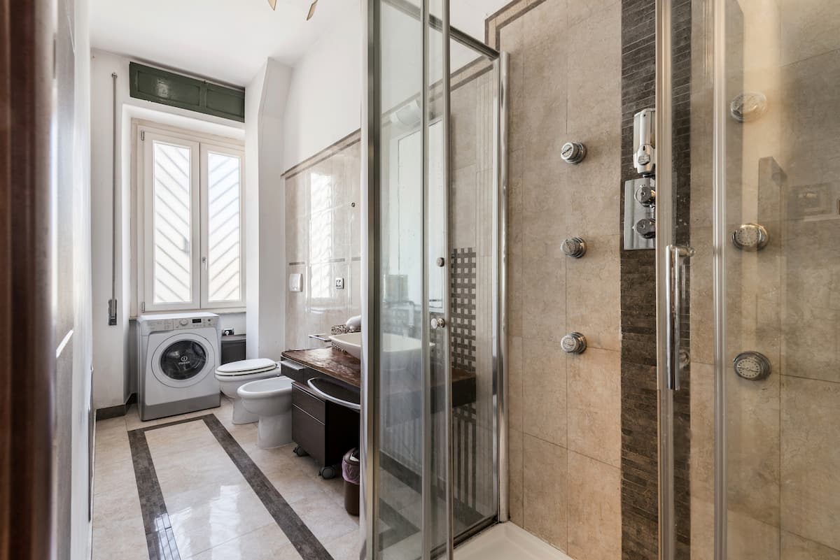 Walk-in shower in the marble bathroom of our apartment in Rome