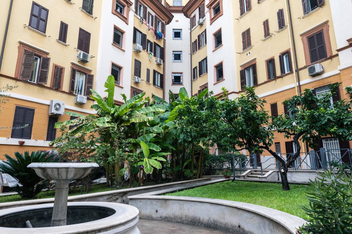 Garden with fountain in the courtyard near San Giovanni Basilica, Rome